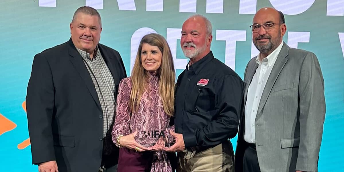 Grease Monkey owner Tom Tobin (second from right) and his wife pictured at the IFA conference